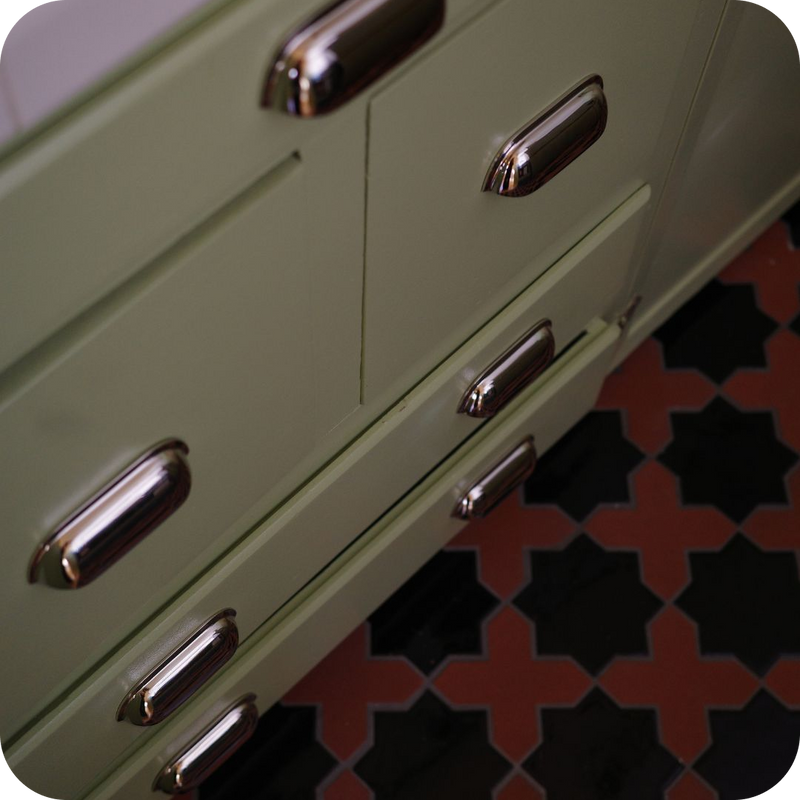 Polished Nickel Cup Pulls on Sage Green Kitchen Cabinets