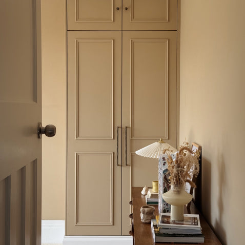 Butterscotch bedroom wardrobes with antique brass hardware