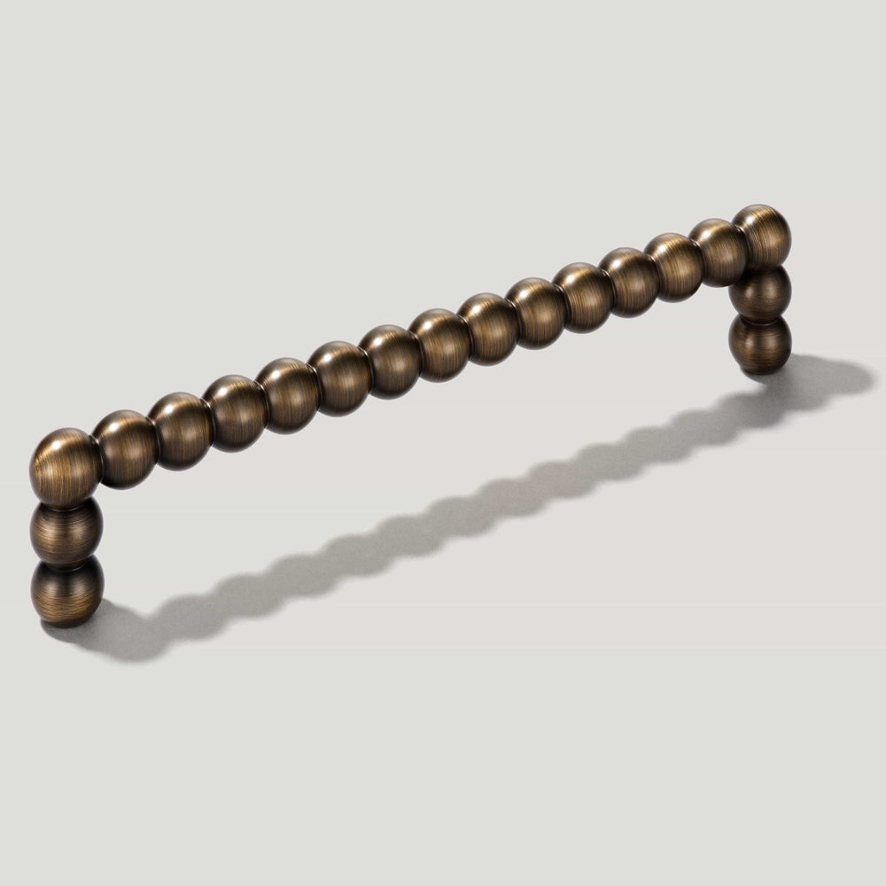 BOBBIN D-Bar Pull - Antique Brass